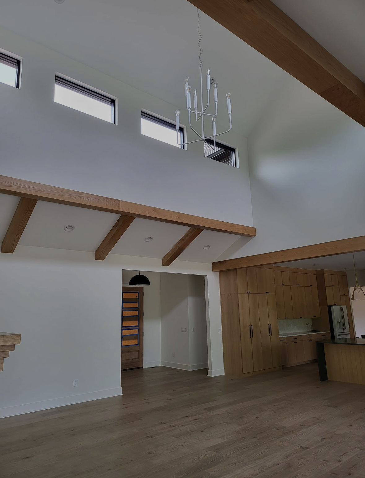Interior painting — high-ceiling living room with wood beams, Springfield MO